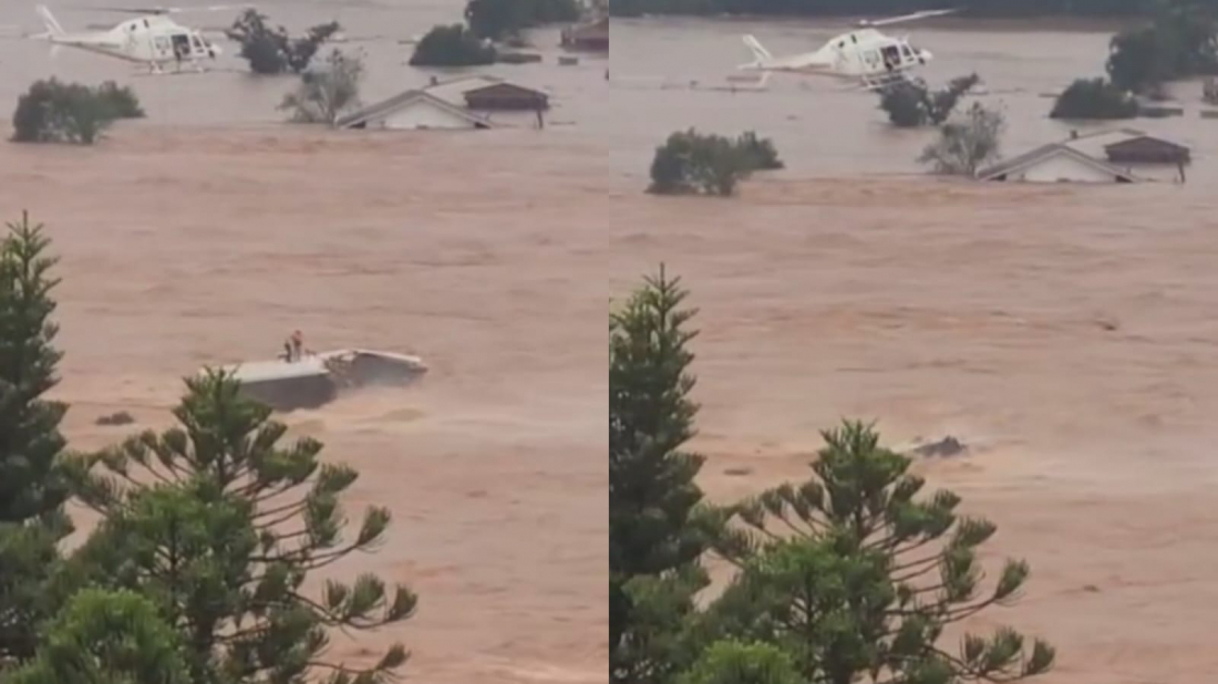 Chuvas no RS: pessoas caem na água enquanto helicóptero realizava salvamento